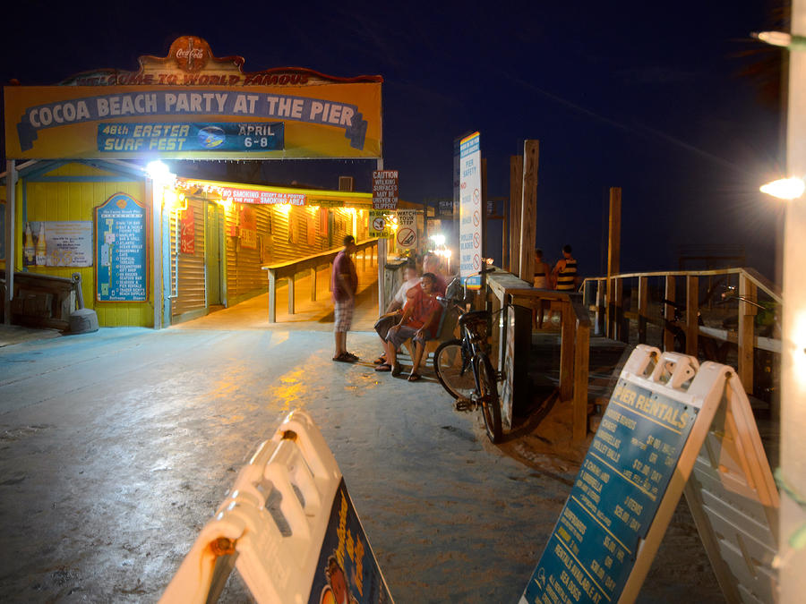 The Cocoa Beach Pier at Night Photograph by Laura DAddona - Fine Art