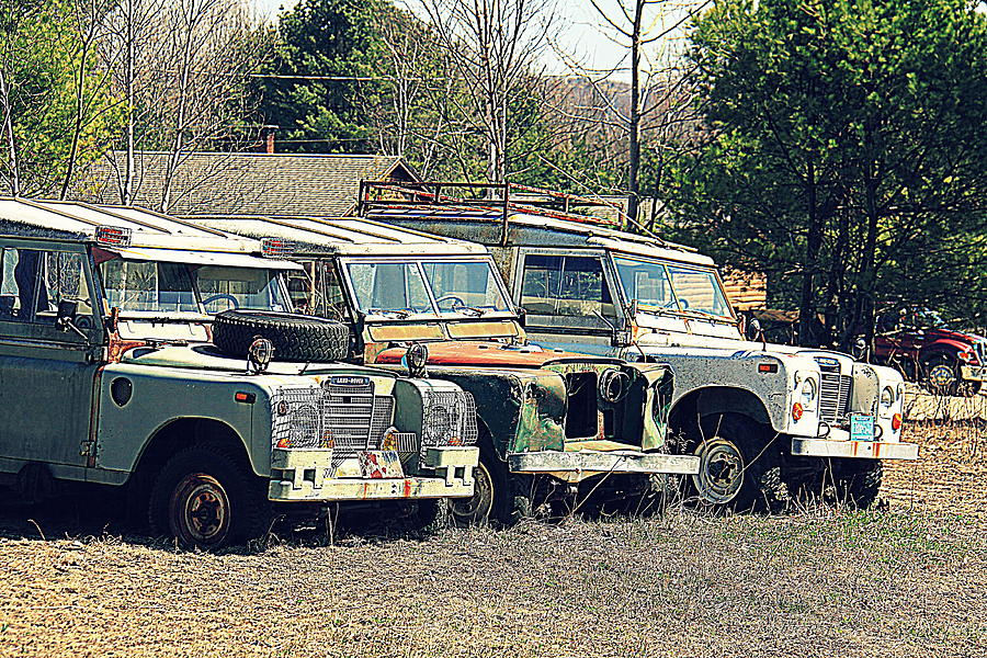 Transportation Photograph - The Land Rover Graveyard by Doug Mills