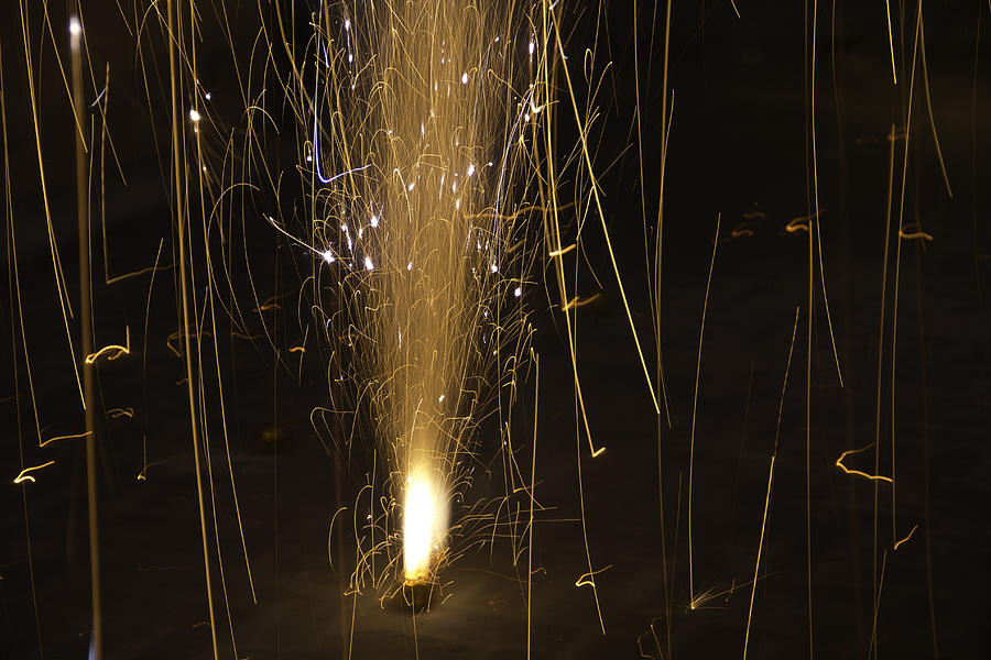 The large amount of sparks put out by a firecracker during Diwali Photograph by Ashish Agarwal