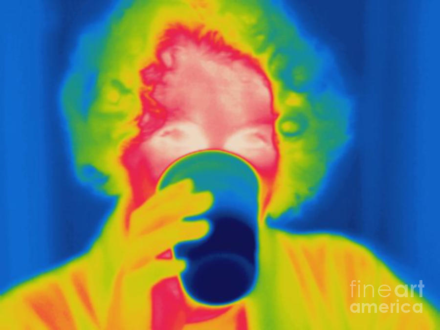 Thermogram Of A Woman Drinking Cold Photograph by Ted Kinsman