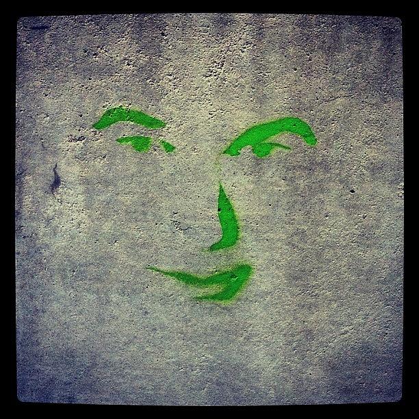 Graffiti Photograph - This Face Was Painted On A Wall Near My by Joseph Stowers