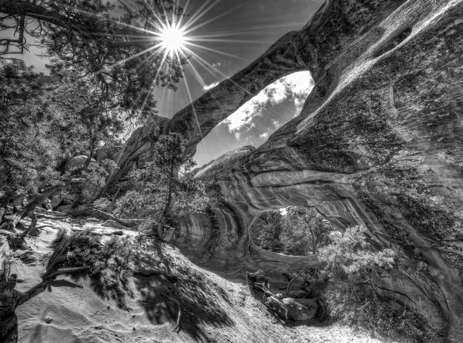 Black And White Photograph - This is Utah No. 17 - Double O Arch Sunburst by Paul W Sharpe Aka Wizard of Wonders