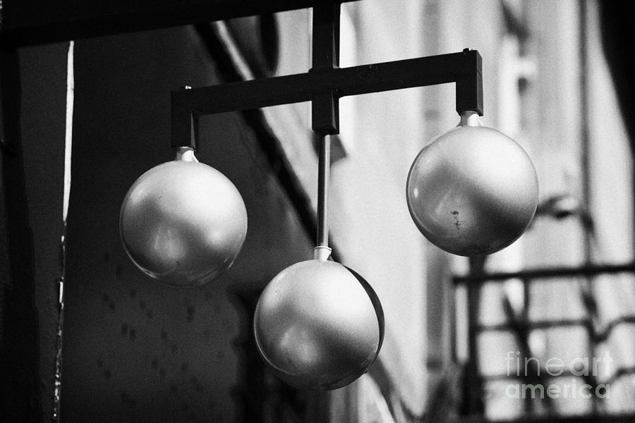 Ball Photograph - Three Golden Balls Pawnbroker Symbol Outside A Pawn Shop In The Uk by Joe Fox