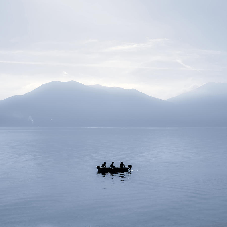 Mountain Photograph - Three men in a boat by Joana Kruse