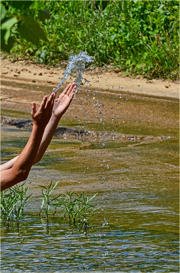 Throwing water I Photograph by Debbie Portwood