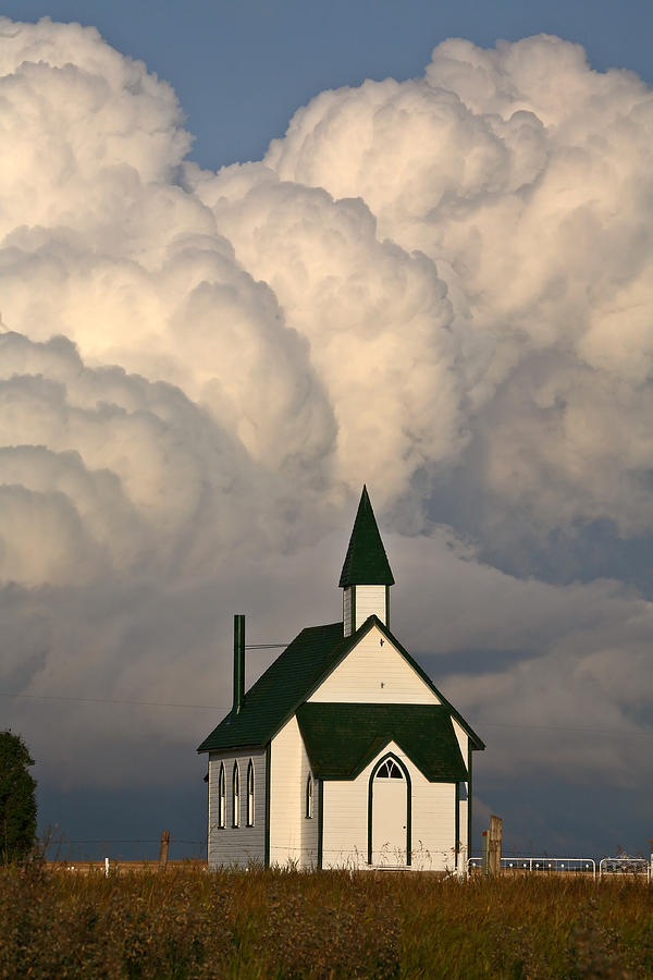 Thunderhead clouds forming behind a country church Photograph by Mark Duffy