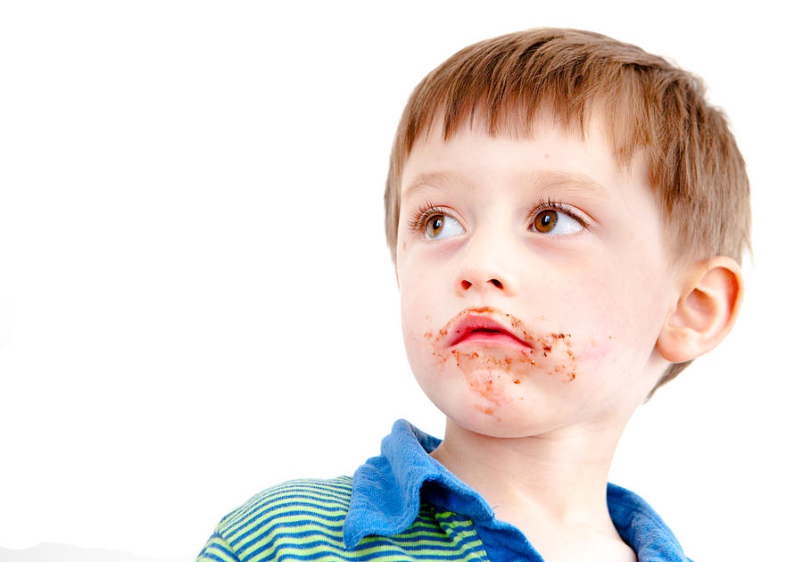 Chocolate Still Life Photograph - Toddler eating chocolate by Tom Gowanlock