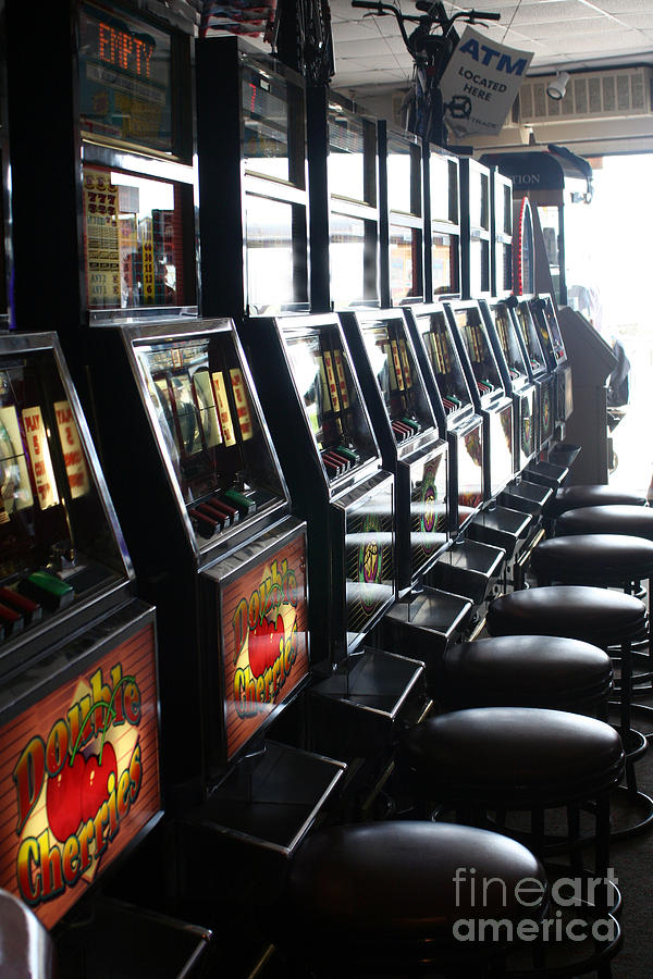 Token Slot Machines Photograph by Susan Stevenson