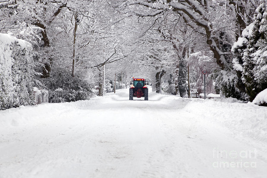 https://images.fineartamerica.com/images-medium-large/tractor-driving-down-a-snow-covered-road-richard-thomas.jpg