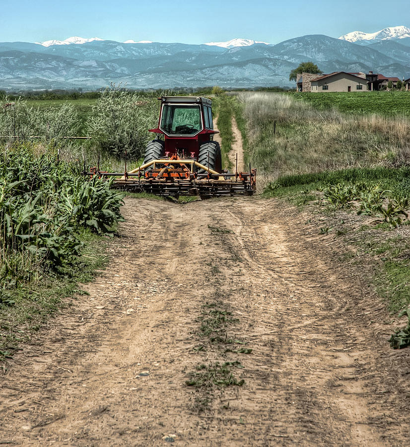 Mountain Photograph - Tractor Waiting for a Driver by Noah Katz