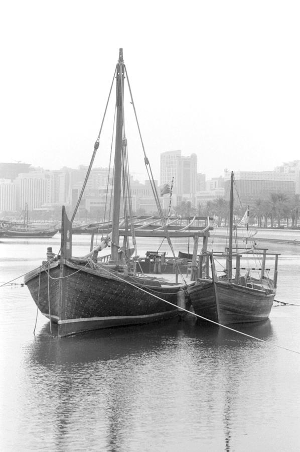 Boat Photograph - Traditional dhows in Doha Bay by Paul Cowan