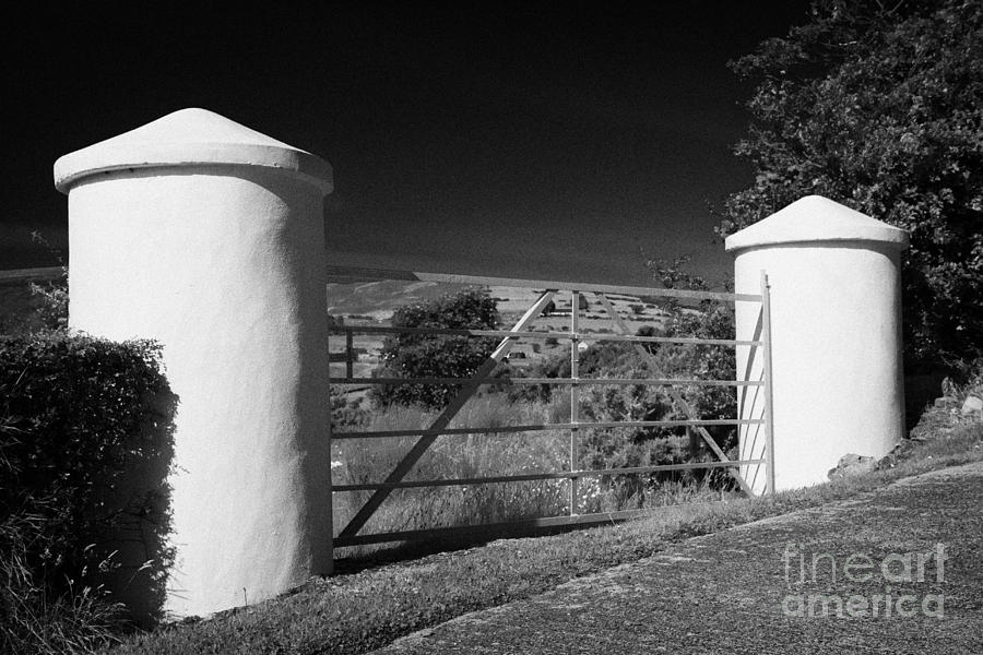 Farm Photograph - Traditional White Stone Pillars Farm Field Entrances On A Farm In Rural County Down Northern Ireland by Joe Fox