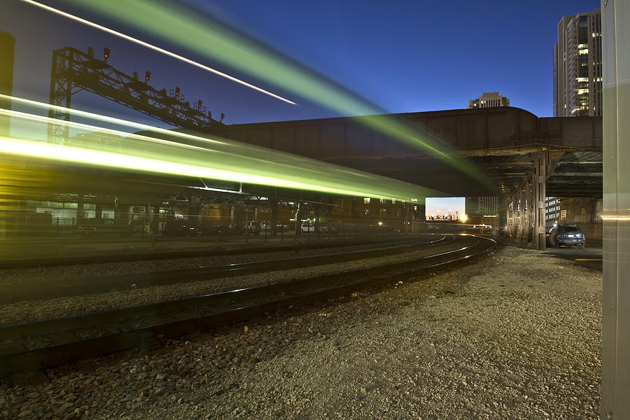 Train creates green streaks of light Photograph by Sven Brogren