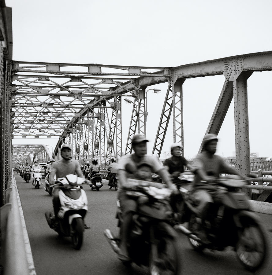Bikers Over Trang Tien Bridge Photograph by Shaun Higson
