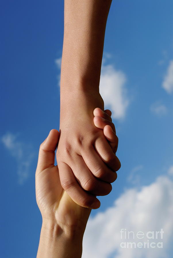 Two children holding hands Photograph by Sami Sarkis