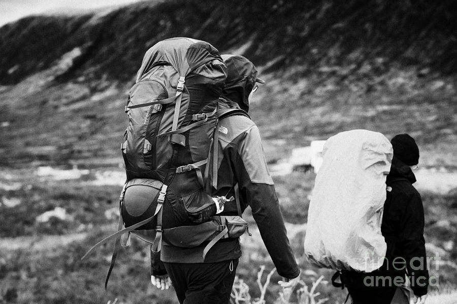 two male walkers hikers in the highlands of scotland glencoe Scotland ...