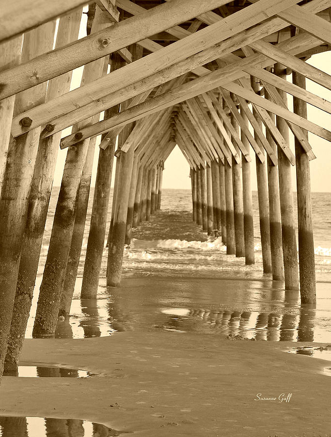 Under the Pier - Sunset Beach in sepia Photograph by Suzanne Gaff