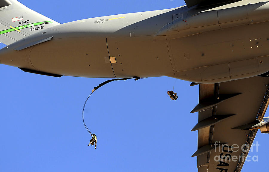 Transportation Photograph - U.s Air Force Airmen Parachute by Stocktrek Images