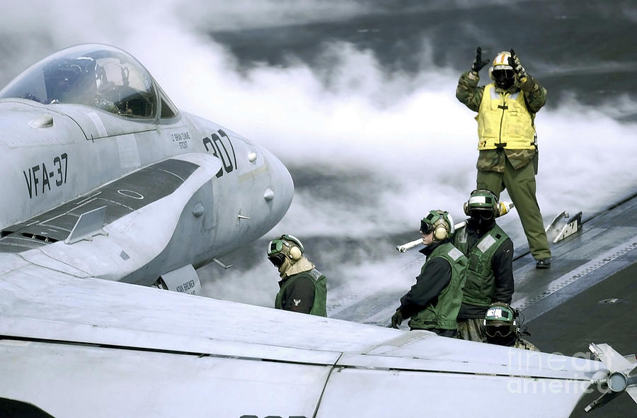 U.s. Navy Sailors Position A Fa-18c Photograph by Stocktrek Images