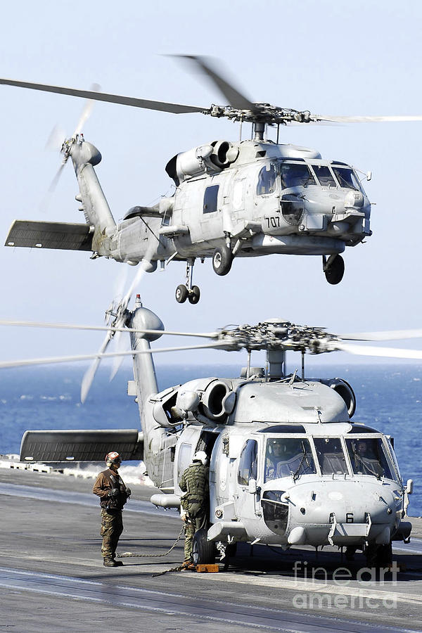 U.s. Navy Seahawk Helicopter Lifting Photograph by Stocktrek Images