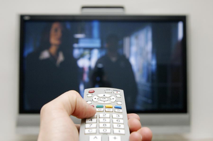 Using A Television Remote Control by Johnny Greig / Science Photo Library