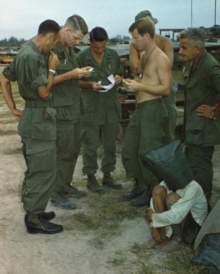 History Photograph - Vietnam War. A Suspected Viet Cong Sits by Everett