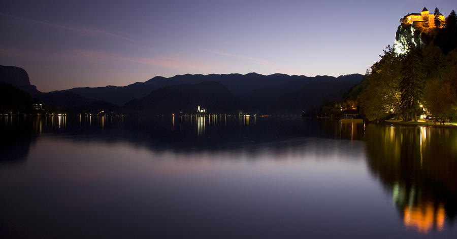 View across Lake Bled at dusk Photograph by Ian Middleton