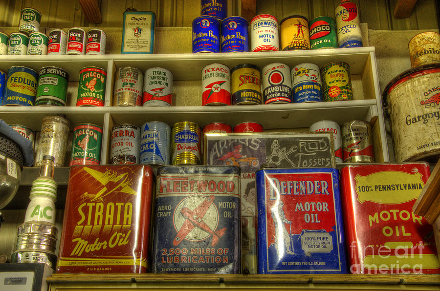 Vintage Garage Oil Cans Photograph by Bob Christopher