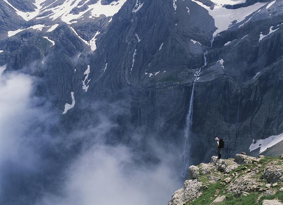 Mountain Photograph - Walker Looking Over Waterfall At Cirque by Axiom Photographic