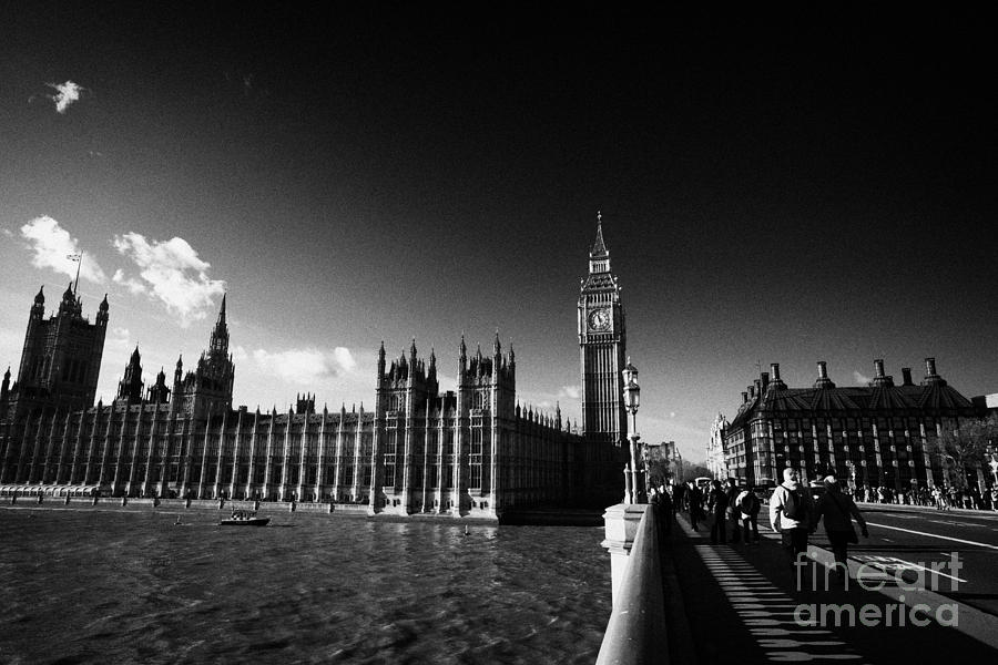 Westminster Photograph - Walking Over Westminster Bridge Towards The Palace Of Westminster Houses Of Parliament Buildings by Joe Fox