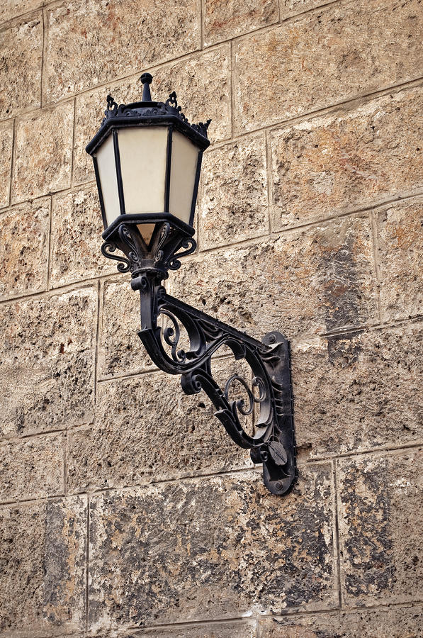 Lamp Photograph - Wall mounted street lamp. by Fernando Barozza
