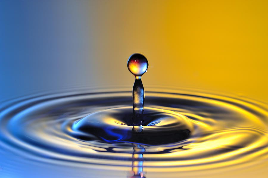 Water drop orange blue by Travel Images Worldwide