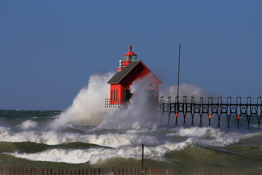 Waves Over the Grand Haven Outer Light Photograph by Richard Gregurich