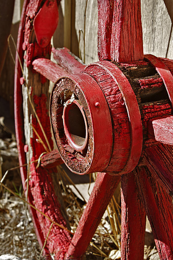 Weathered Red Wagon Wheel Photograph by Phyllis Denton