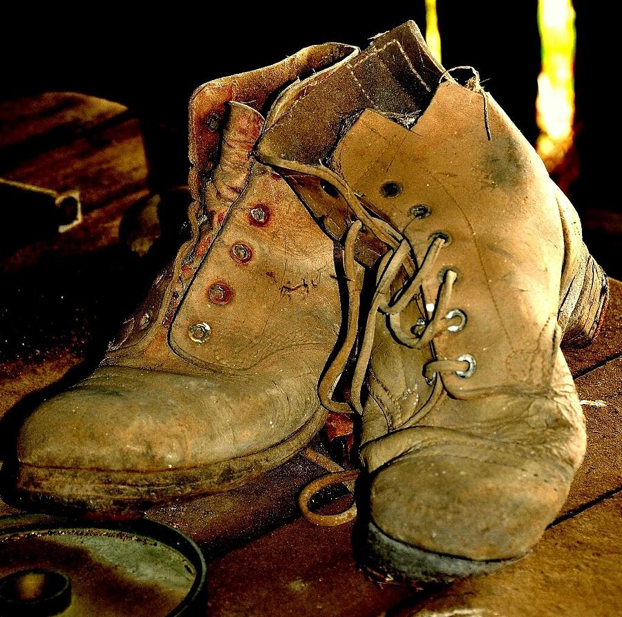 Weathering Boots Photograph by Lynnette Wells