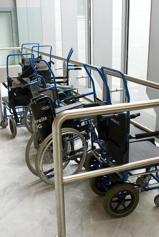 Paris Photograph - Wheelchairs At Airport by Mark Williamson