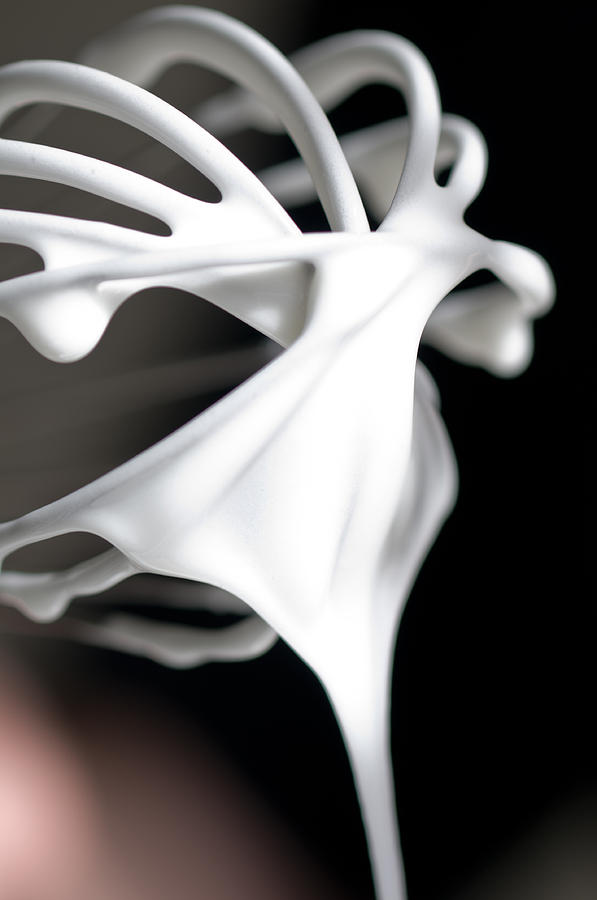 Whisk with creamy egg white close up  Photograph by U Schade