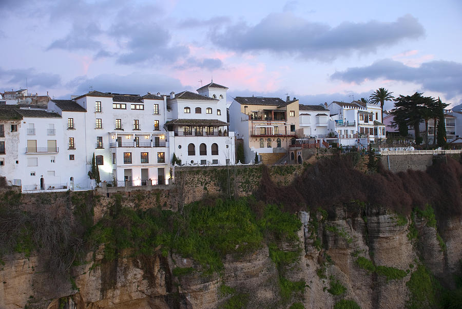 White houses at sunset hanging over clif ronda Photograph by Perry Van Munster