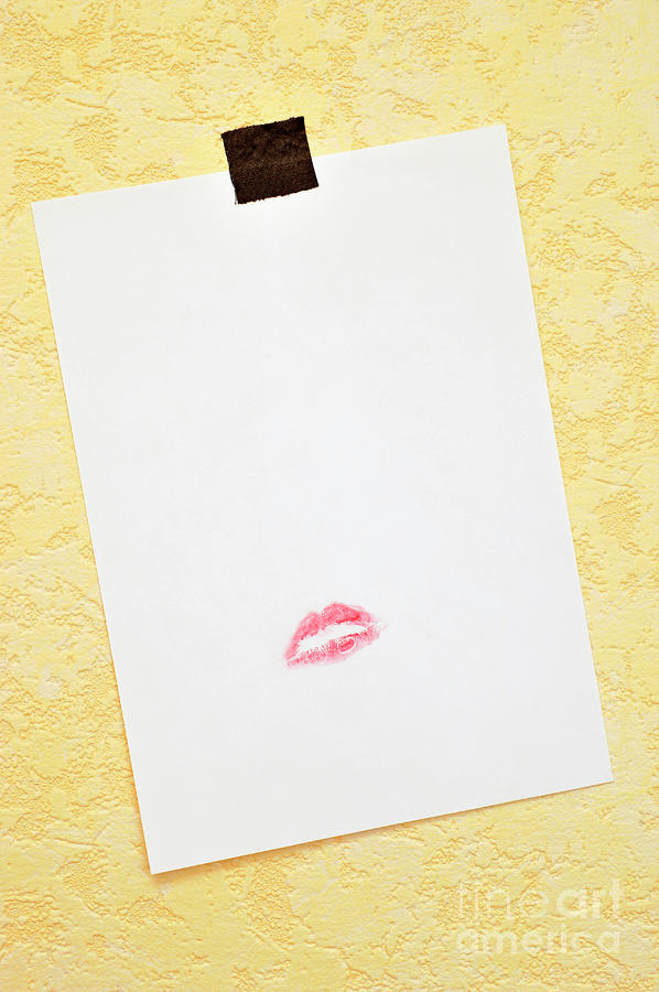 Glamour Photograph - White paper hanged on wall with lipstick kiss by Sami Sarkis