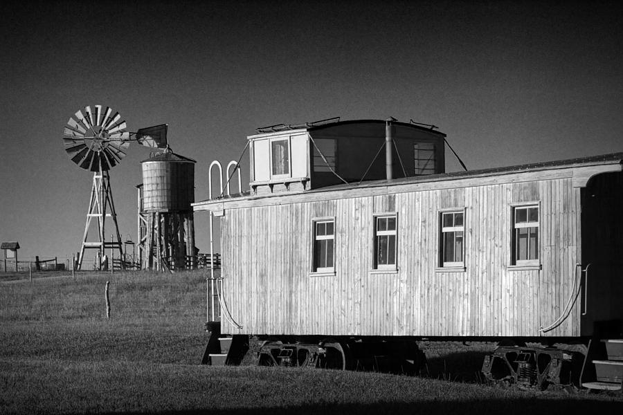 Windmill and Caboose from a Train in 1880s Town Photograph by Randall Nyhof