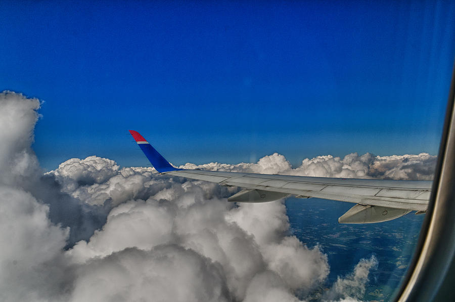 Airplane Photograph - Wing and Clouds by Robert Swinson