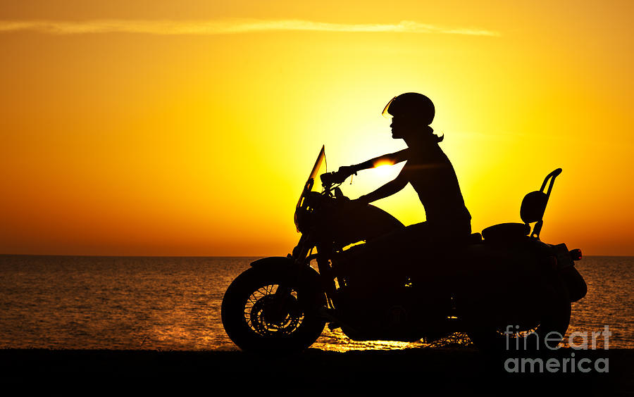 Woman biker over sunset  Photograph by Anna Om