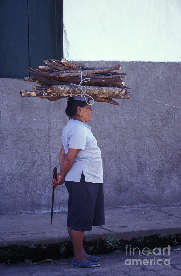 WOMAN CARRYING FIREWOOD Nicaragua Photograph by John  Mitchell