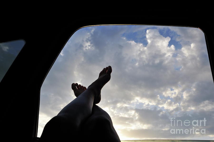Car Photograph - Womans legs barefeet out of car window by Sami Sarkis