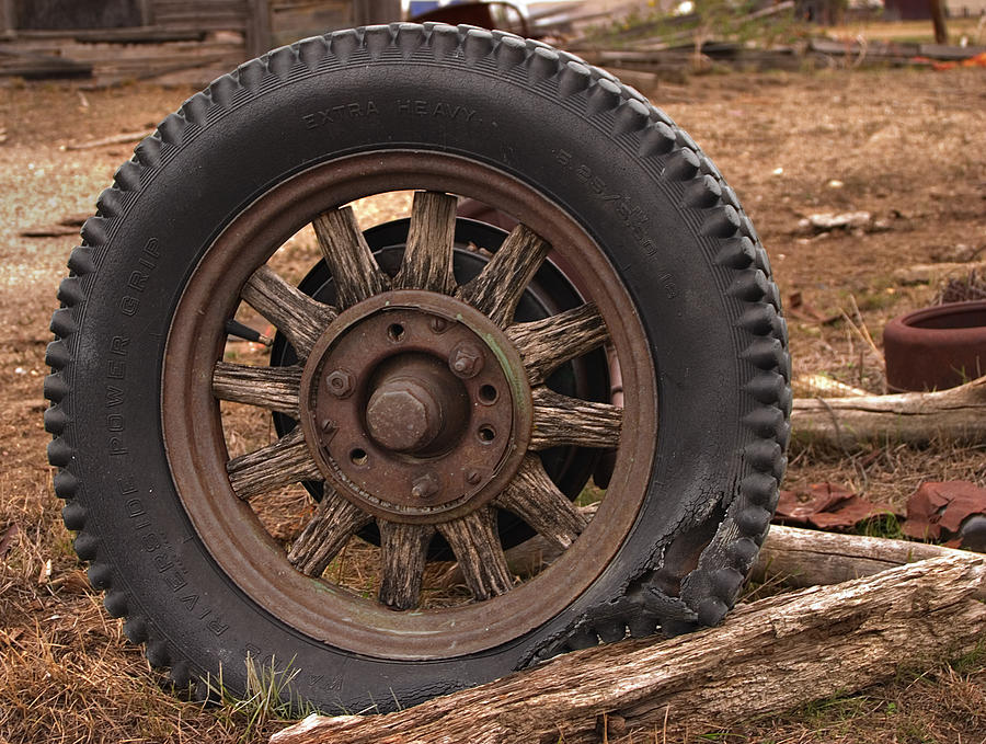 Wooden Spoked Tire Photograph by Grant Groberg