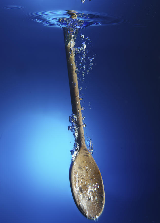 Wooden Spoon In Water Photograph by Terry Mccormick