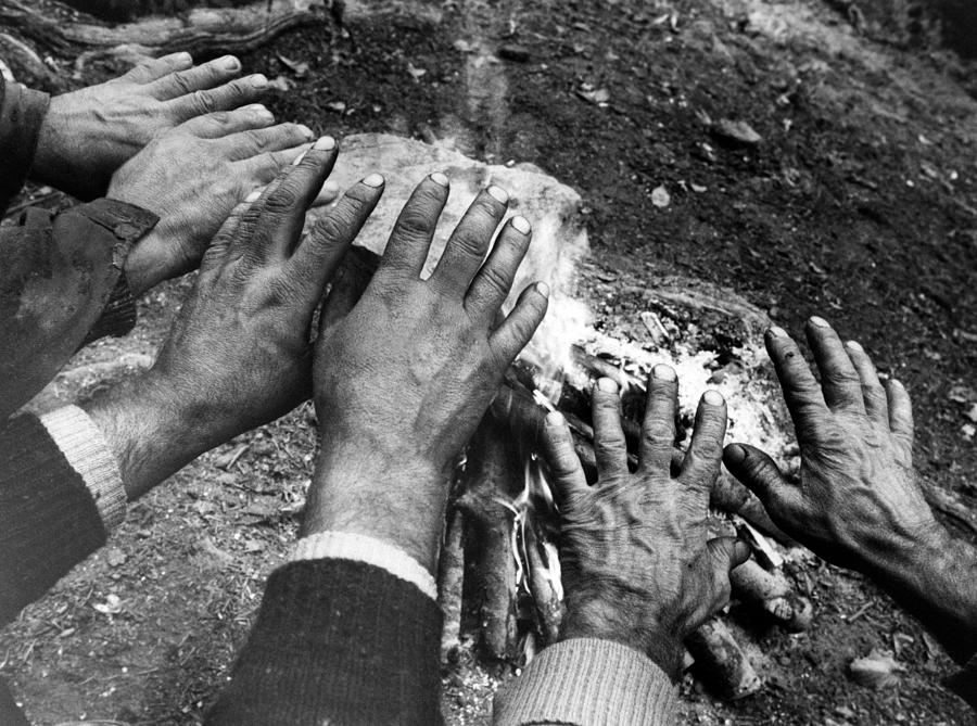 Workers hands by the fire Photograph by Emanuel Tanjala
