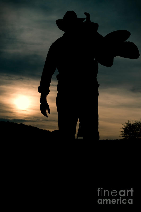 Sunset Photograph - Working man silhouette at sunset - Cowboy calling it a day by Andre Babiak