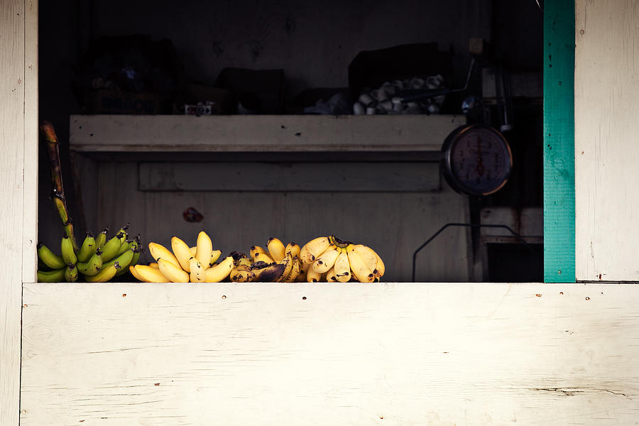 Yellow bananas on a ledge in the Caribbean Photograph by Anya Brewley schultheiss