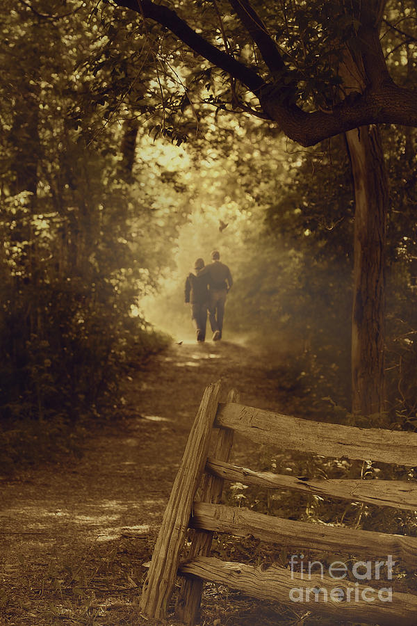 couple walking down a path